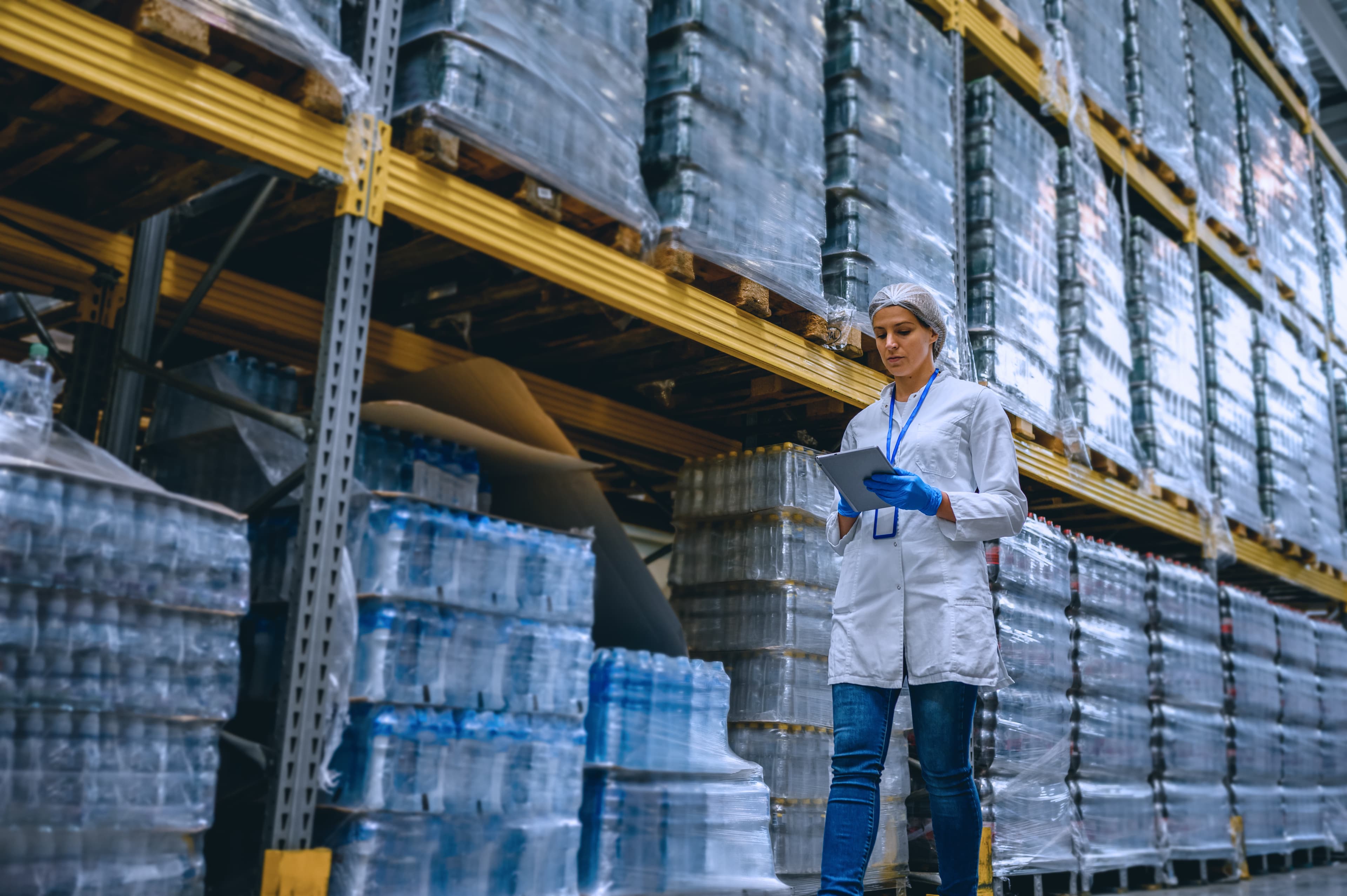 QA technician inspecting bottled water